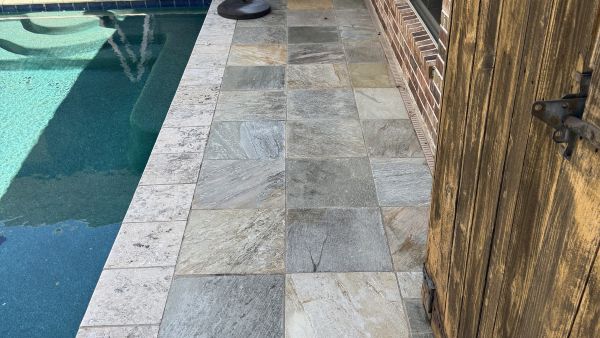Stone pool deck after cleaning by Stonevale Exterior Co. showing clean restored surface