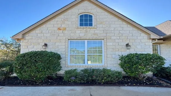 Stone home exterior after house washing by Stonevale Exterior Co. showing clean stonework
