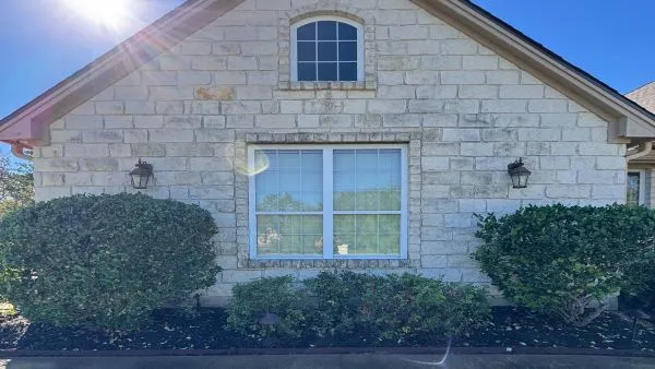 Stone home exterior before house washing by Stonevale Exterior Co. showing dirt and buildup