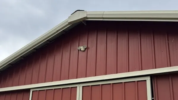 Barn gutters and fascia after soft washing by Stonevale Exterior Co. showing clean white gutters