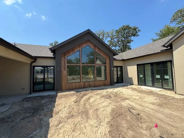 New construction home before post-build cleaning by Stonevale Exterior Co. showing construction dust and debris