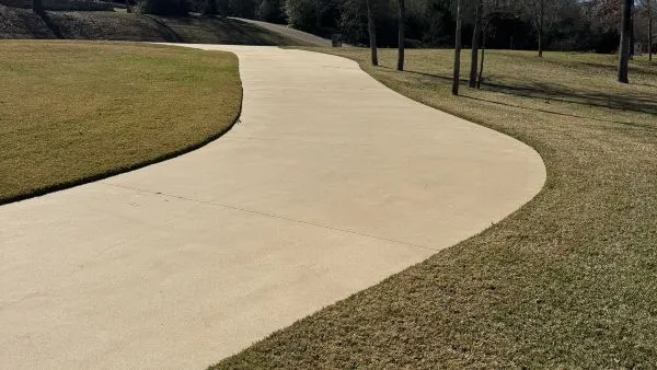 College Station driveway after pressure washing by Stonevale Exterior Co. showing clean concrete