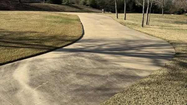 College Station driveway before pressure washing by Stonevale Exterior Co.