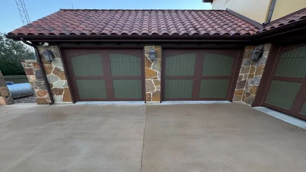 Garage driveway after pressure washing by Stonevale Exterior Co. showing clean concrete