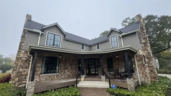 Home windows before professional window cleaning by Stonevale Exterior Co. showing dirt and water spots