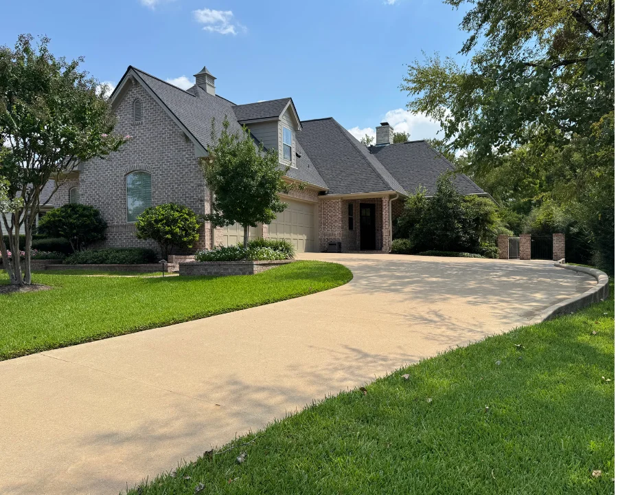 Beautiful brick house with clean driveway perfect for real estate listing preparation in Navasota